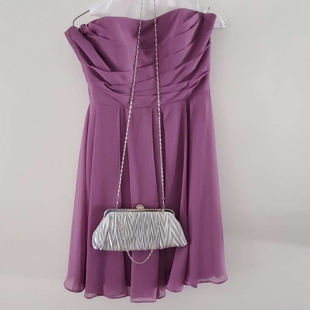 Womans purse silver light grey in color long chain